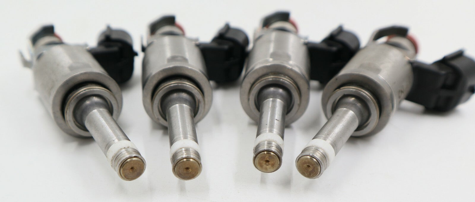 4-pack of new fuel injectors for Ford and for Mazda P501-13-250A.