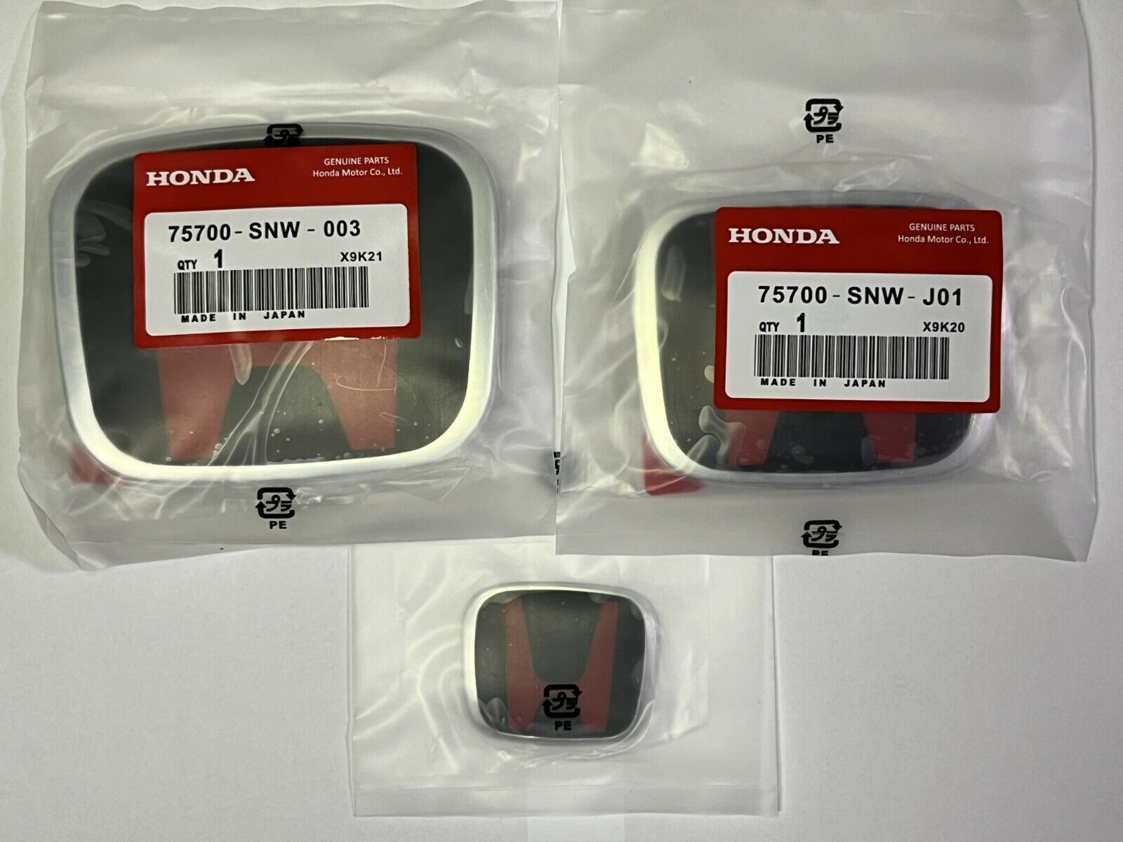 06-15 for Civic 4DR Sedan JDM, red and black front and rear steering wheel badges; 09-11 Fit