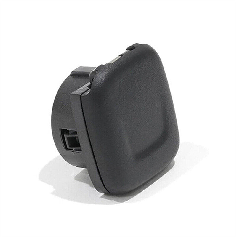 A pair of black center console power outlet covers for 2014, 2015, and 2016 for Chevrolet Silverado.