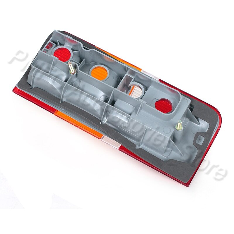 A pair of rear bumper turn signals and brake lights for Ford Transit MK4 and MK5 models from 1991 to 2000.